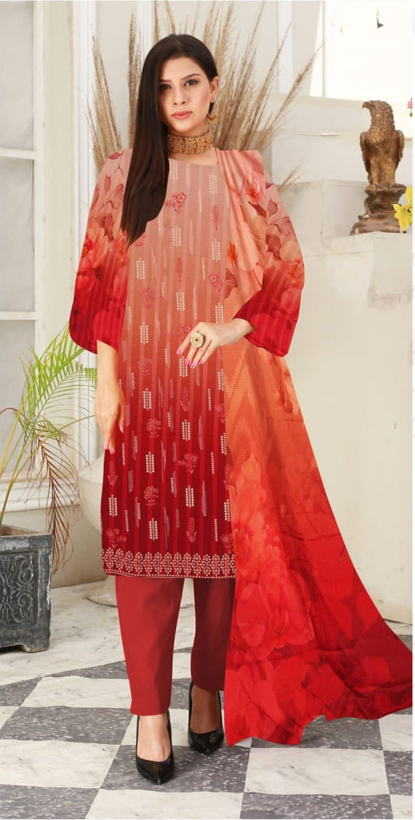 Woman wearing a red and orange traditional outfit with a matching dupatta in an indoor setting.